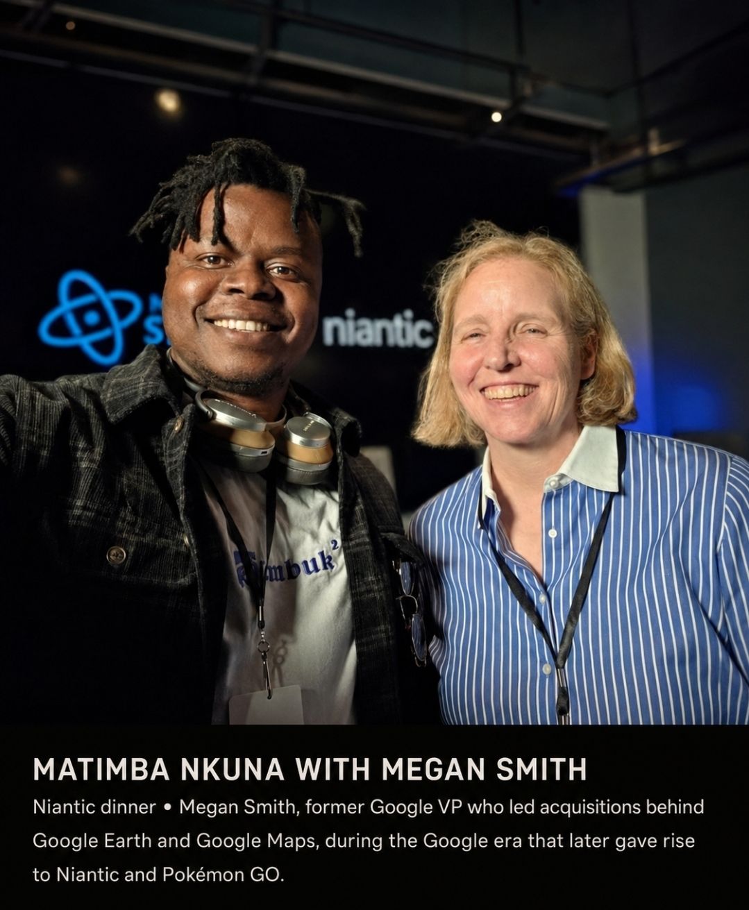 Matimba Nkuna and Megan Smith smiling together at the Niantic dinner, the Niantic logo lit behind them