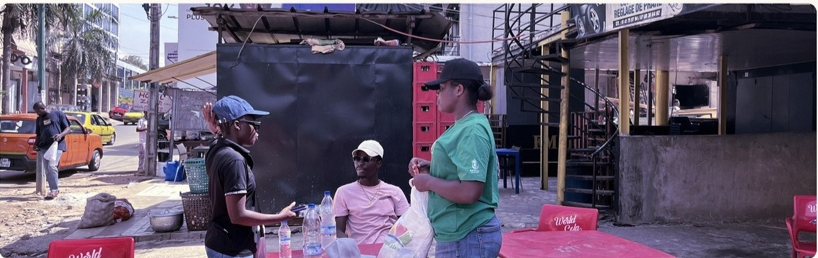 A Timbuk2 contributor speaking with a local business owner during fieldwork